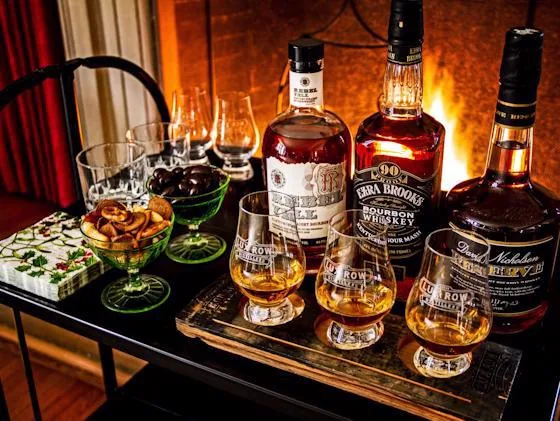 Selection of American whiskey bottles and tasting glasses prepared for a whiskey tasting session