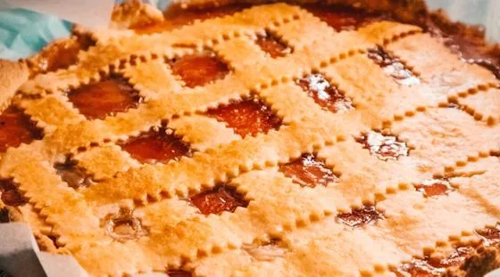 Freshly baked homemade pies arranged on a baking tray